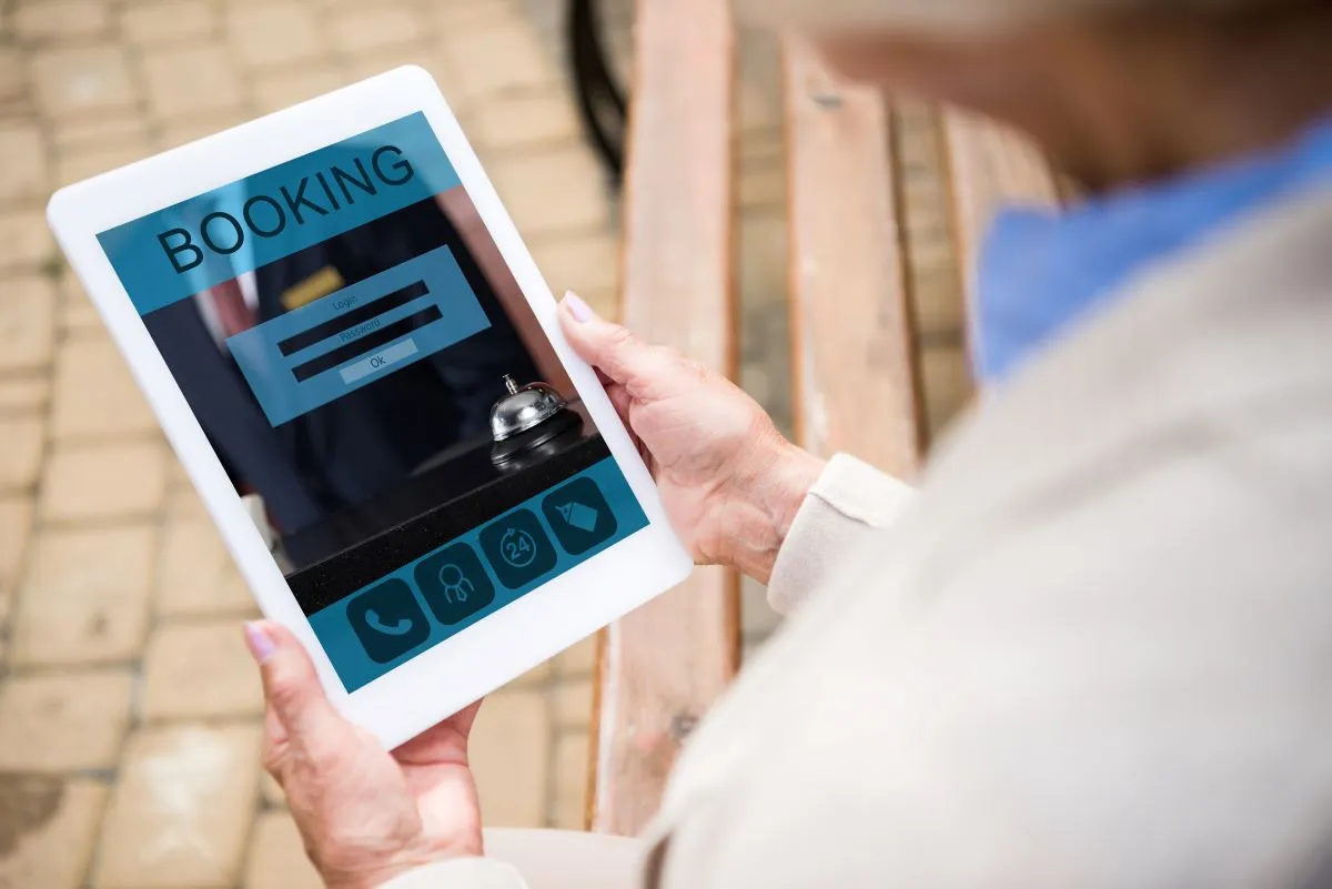 person booking through booking system on tablet