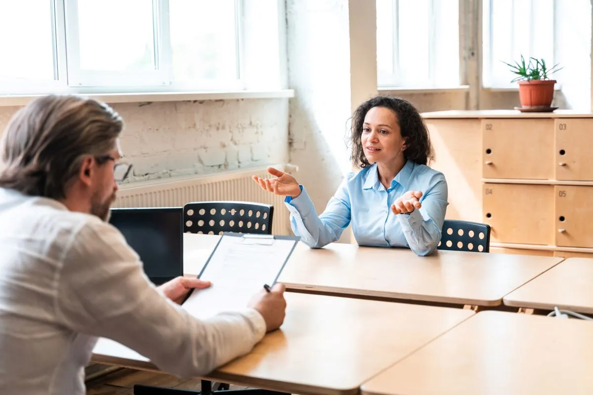 Teacher discussing career opportunities with an education recruitment consultant