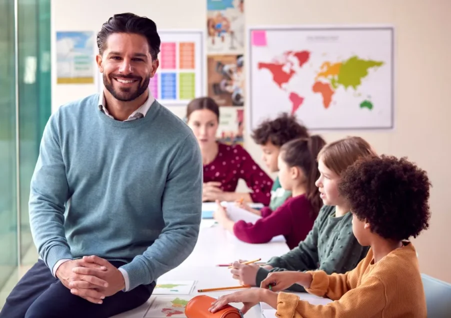 portrait-of-smiling-male-elementary-school-teacher